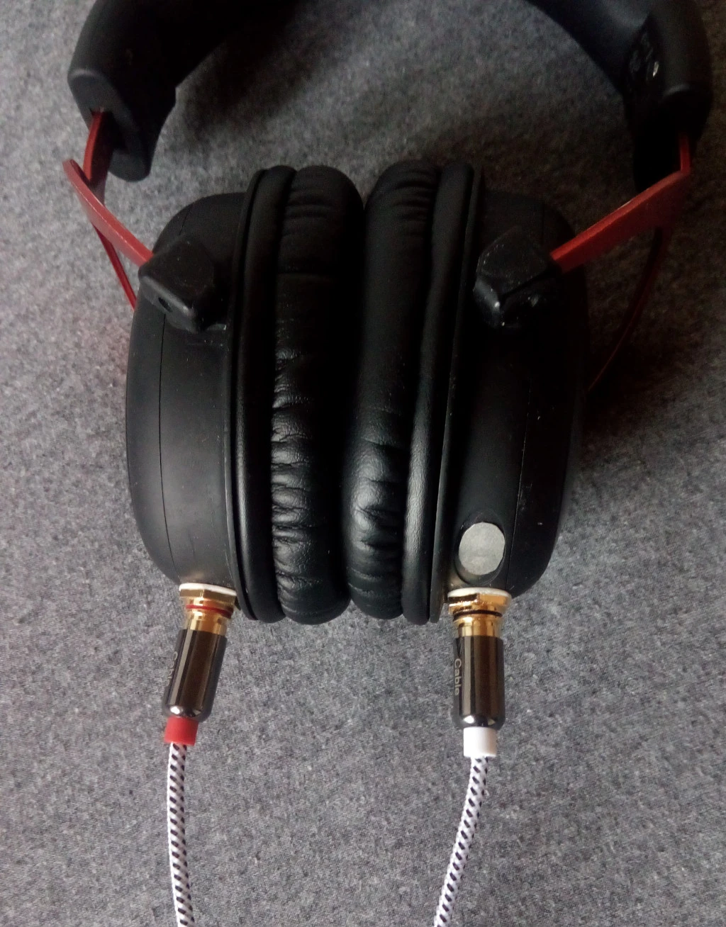 My headphones with RCA sockets and a cable attached.